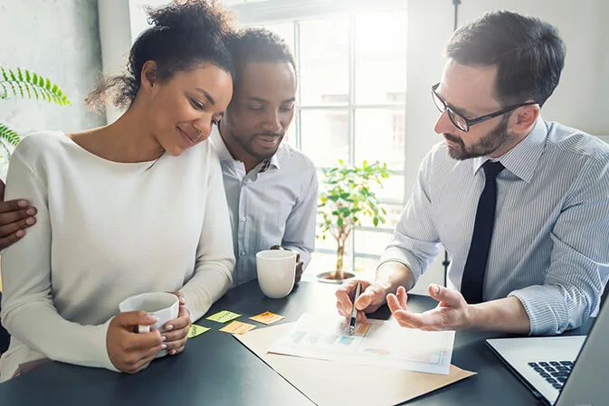 couple meeting with mortgage broker