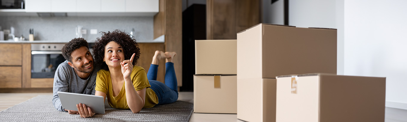 couple on floor with moving boxes